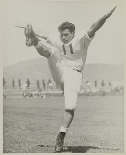 Herman John Wedemeyer kicking a football, 1948