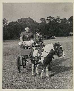 Herman John Wedemeyer in uniform with a young boy in Golden Gate Park near Kezar Stadium, 1948