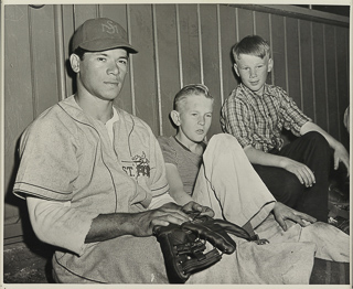 Herman John Wedemeyer with two boys in dugout, April 12, 1947