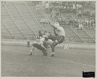 Herman John Wedemeyer kicking a field goal, 1947