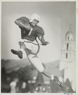 Herman John Wedemeyer with football, 1946