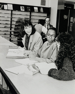 Stephanie Bangert with a student, faculty, and staff, 1990