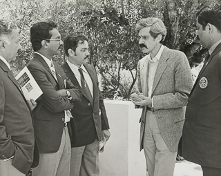 Politics professor Wilber Chaffee meets with Rotary International delegation, 1986