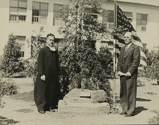 Brother Austin Crowley (left) and Louis Felan LeFevre (right) dedicating a plaque and redwood tree in honor of the Sesquicentennial of the United States Constitution, 1937