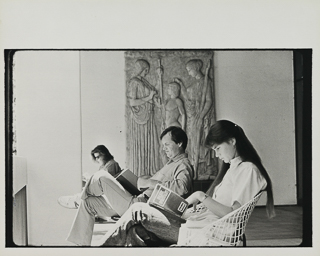 Three students reading on the balcony of Saint Albert Hall Library, 1986