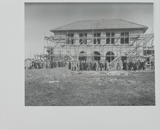 A gathering in front of the science building (Galileo Hall) of the Moraga campus during construction, February 19, 1928