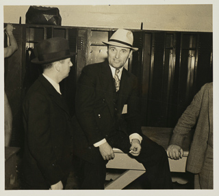 Edward P. &quot;Slip&quot; Madigan in locker room with others, 1921 - 1939