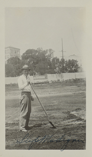 Edward P. &quot;Slip&quot; Madigan on the grounds of the Oakland campus wih Providence Hospital in the background, 1926