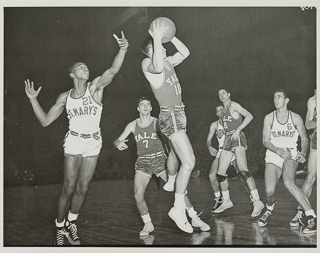 Lyn Dickson (#21) and Don Kramm (#6) of the Saint Mary&#39;s College basketball team playing against Yale, 1949