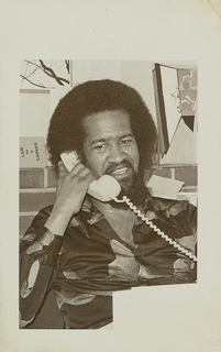 Thomas &quot;Tom&quot; Brown speaking on a telephone, 1975