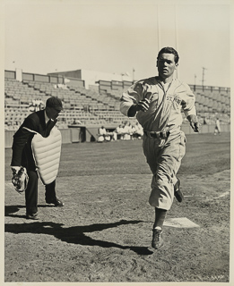 Herman John Wedemeyer crossing home plate on a baseball field, April 12, 1947