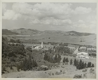 View of Moraga campus facing west with surrounding fields and orchards, 1930 - 1960