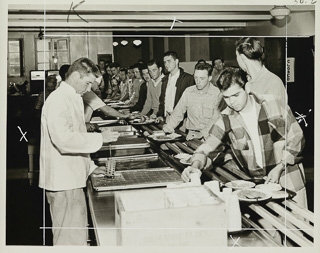 Students being served food at the cafeteria in Oliver Hall, 1950