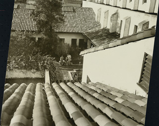 View from the Brothers&#39; Residence of students conversing in a patio, undated