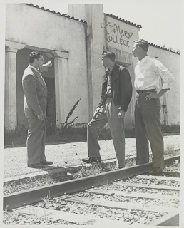 William Bettencourt and two young men in front of Saint Mary&#39;s College railroad station, 1950