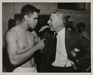 Van Giesan and Phelan in the locker room at the Saint Mary&#39;s College vs Washington football game, 1950