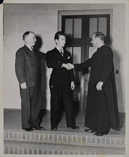 Professor Louis LeFevre and Brother President Austin Crowley congratulating Stan Parmisano for winning the National Championship in the James Monroe National Collegiate Oratorical Competition, 1945