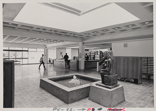 Lobby of Saint Albert Hall Library with Renzi&#39;s Madonna and Child, fountain, tile floor, and card catalogs, 1970