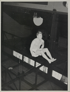 A student performing a flip while on the trampoline, 1970