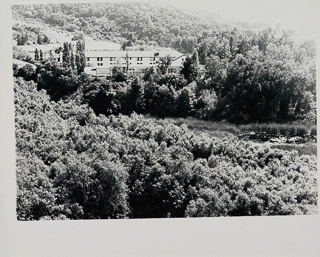 View of the upper reaches of Lake Lasalle with Assumption Hall and outbuildings in background, May 8, 1972