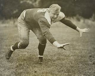 Football player Wilbur Wilkin in uniform, undated