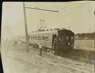 People standing by a train at Saint Mary&#39;s College station in front of the Moraga campus, 1935