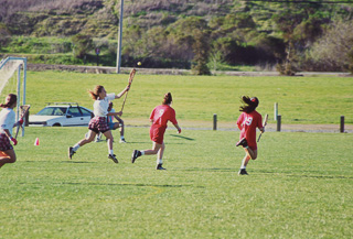 The Saint Mary&#39;s College women&#39;s lacrosse team playing against an unknown team, 1995