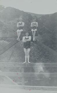 Three student swimmers posing, 1928