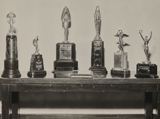 Trophies from the Western Catholic High Schools Press Convention, April 17, 1948