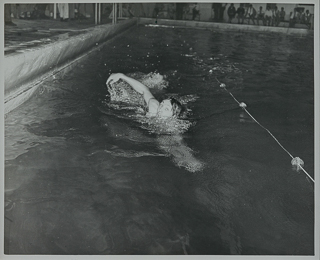 Schulz swimming in a pool, March 21, 1947