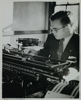 Student using a typewriter, undated