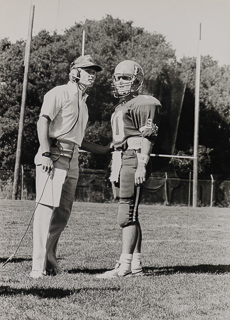 Tim Rosencranz, football quarterback, at right with unidentified coach, September 9, 1989